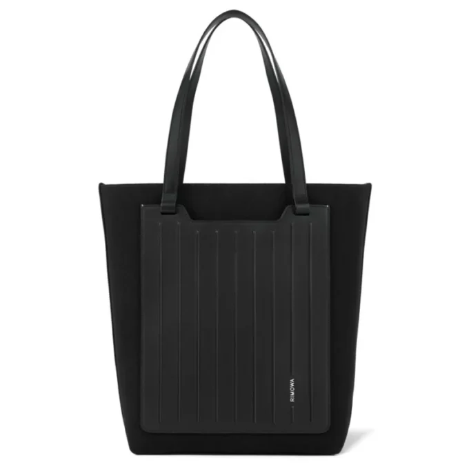 Never Still Vertical in pelle e tela TrageBags