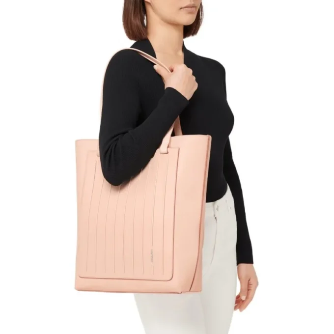 Never Still Vertical in pelle e tela TrageBags
